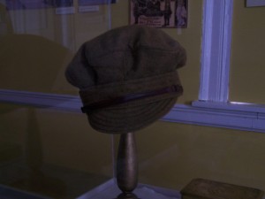 Peak hat with leather strap and metal grommets. Wool. N.d.: WHS 92.8.3